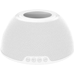 A white wireless charging speaker with a textured mesh design and control buttons at the base.