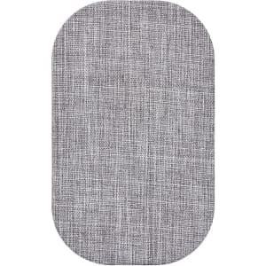 A grey wireless charger with a textured fabric finish, featuring a rounded rectangular shape and a branding logo.