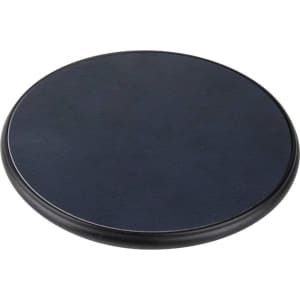A round, black wireless charger with a textured surface, designed for eco-friendly charging of devices.