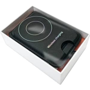 A black magnetic card wallet and wireless charging stand in a white box. It includes a branding logo.
