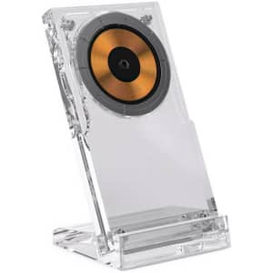 A clear acrylic wireless charging stand featuring a circular charging pad with a gold and black centre.
