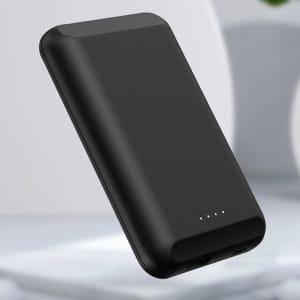A black magnetic wireless power bank with a sleek design and LED indicators. Features branding.