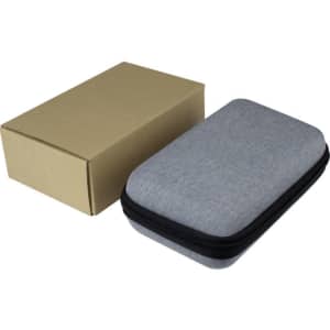 A grey zippered case with a cardboard box beside it. The case is compact and rectangular in shape.