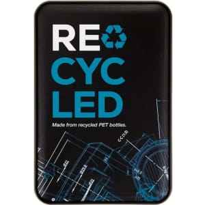 A rectangular power bank with a black surface featuring a blue recycled logo and blueprint designs, made from recycled PET.