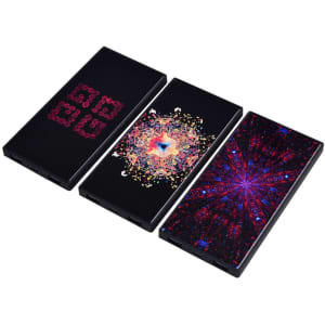 Three black power banks with vibrant, multicoloured abstract designs. Each features a unique pattern.