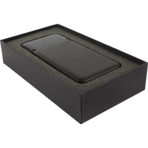 A dark green wireless power bank in a black presentation box, featuring a sleek design and branding.