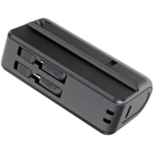 A black power bank with slots for Lightning and Type-C connectors, featuring a built-in stand.
