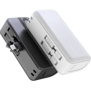 A power bank stand in white and black, featuring a compact design with integrated connectors and LED indicators.