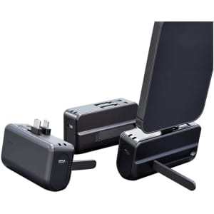 A black Genoa Capsule Power Bank Stand with a foldable support and multiple ports for charging devices.