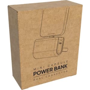 A kraft cardboard box containing a mini capsule power bank with a dual connector, featuring minimalistic outlines and a logo.