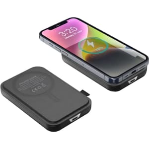 A black power bank with a magnetic attachment, alongside a smartphone displaying charging status.