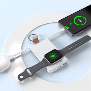 A magnetic watch power bank in white with a black watch and a phone connected, on a light blue background.