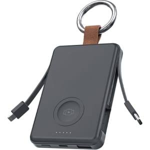 A black power bank with a key ring, featuring built-in charging cables and a circular wireless charging pad.