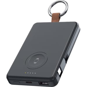 A black magnetic power bank with a keyring attachment, featuring a USB port and charging indicators.