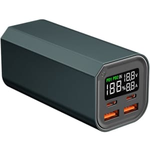 A dark green power bank with multiple USB ports and a digital display for charging devices.