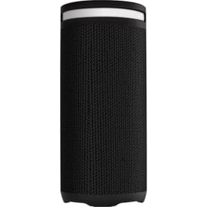 A cylindrical black wireless speaker with a textured surface and a white accent on top, featuring a logo.