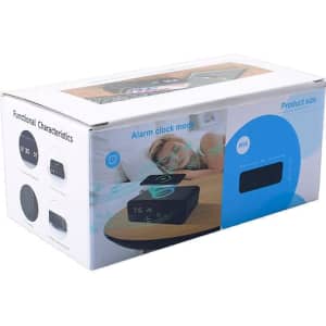 A wireless charging speaker and alarm clock in a box, featuring a dark exterior and display for time settings.