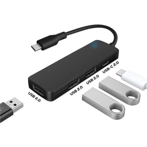A black USB hub with two USB Type-A ports and one USB Type-C port, accompanied by two USB drives.