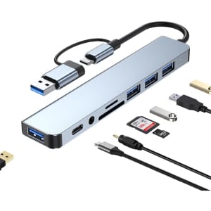 A metallic silver USB hub with multiple ports, including Type-C, Type-A, and card reader slots.