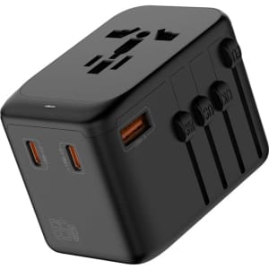 A black travel adaptor with multiple ports, including USB-C and USB-A, designed for charging devices.