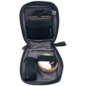 A black eco accessory pouch containing a charger, cables, and a small device, with a branded logo on the exterior.