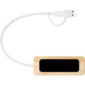 A bamboo USB hub with a white cable and a black panel, featuring a logo on the side.
