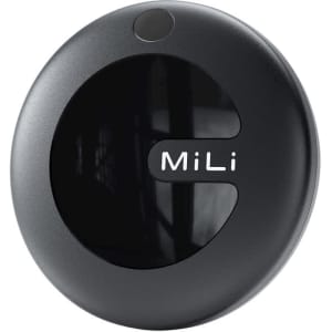 A round black tracking tag with a glossy finish and a logo, featuring a smooth surface.