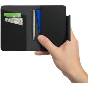 A black passport holder is shown, holding credit cards and a pen inside. It features a sleek, minimalist design.
