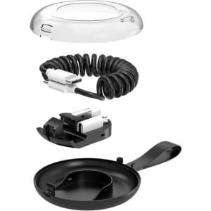 A black coiled charging cable kit with multiple components, including a clear cover and a base, featuring a logo.