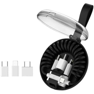 A charging cable kit featuring white cables and adapters in a black, round case with a clear lid.