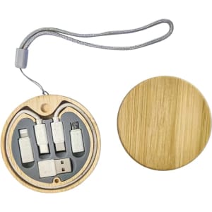 A round wooden kit containing multiple charging cables in grey, featuring a secure loop for easy carrying.