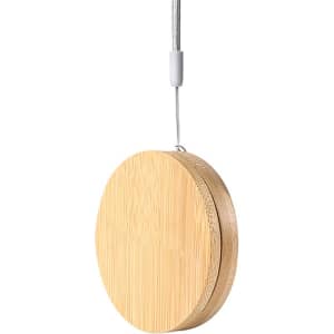 A round, bamboo charging cable kit with a grey hanging loop, designed for eco-friendly use.