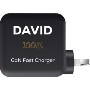A black GaN quick charger with a plug and a branding logo, featuring a compact design for travel use.