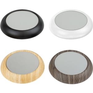 A set of four USB cup warmers in black, silver, light wood, and dark wood finishes, featuring a circular design and glass top.