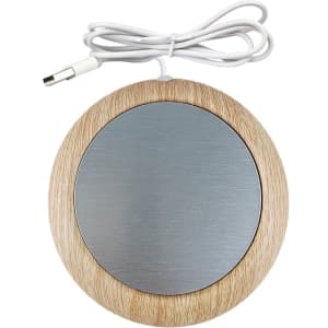 A round USB cup warmer with a wooden exterior and a silver heating surface, featuring a connected cable.
