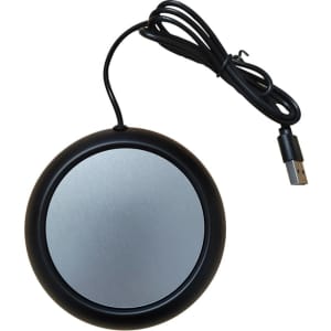 A round black USB cup warmer with a silver surface and a connected black cable.