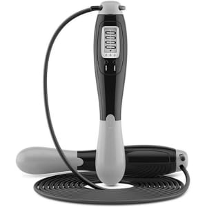 A digital skipping rope in black and grey, featuring a handle with a display and a long rope coiled beside it.