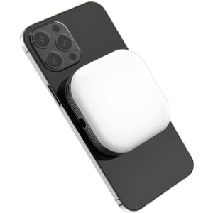 A white magnetic LED selfie light attached to a black smartphone. The product has a logo on its surface.