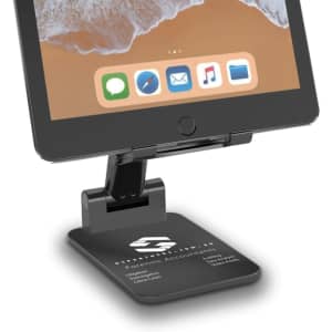 A black foldable phone stand with a sturdy base, designed for tablets and smartphones, featuring a branding logo.
