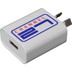 A white USB wall charger with a branded logo, featuring a single USB port and foldable prongs.