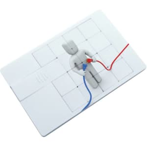 A white puzzle-themed credit card flash drive with a 3D figure connected by red and blue wires. It features a logo.