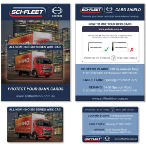 A promotional product featuring an RFID card shield in a blue and white design, alongside a red truck image.