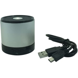 A silver Bluetooth speaker with a black base, accompanied by a USB charging cable.