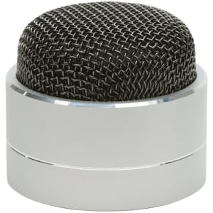 A compact silver Bluetooth speaker with a black mesh top design. It features a sleek, rounded shape and a branding logo.