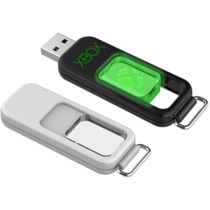 A black and white flash drive with a green logo, featuring a sliding mechanism. It has a keychain attachment.