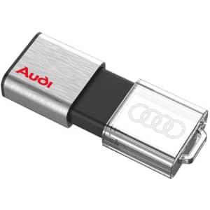 A silver and black flash drive featuring a transparent casing and a logo.