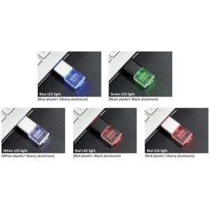A collection of four flash drives in various colours: blue, green, white, and red, with different LED light indicators.