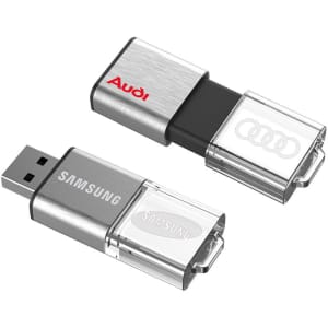 A silver and black flash drive with a metal casing, featuring branding on each side.