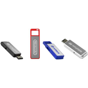 A collection of four flash drives in black, red, blue, and silver, each featuring different designs and logos.