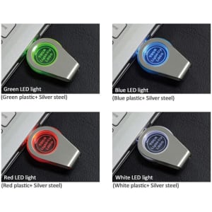 A collection of four flash drives with different LED light colours: green, blue, red, and white, on a silver background.